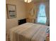 Comfortable bedroom with a queen-size bed and large window at 4163 Pirates Lndg, Winter Haven, FL 33884