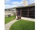 Another view of the home's sunroom and backyard at 4163 Pirates Lndg, Winter Haven, FL 33884