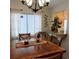 Bright dining area with a square wooden table and four chairs at 4163 Pirates Lndg, Winter Haven, FL 33884