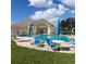 Relaxing community pool area with tables and umbrellas at 4163 Pirates Lndg, Winter Haven, FL 33884