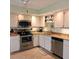 Well-equipped kitchen with ample cabinetry and stainless steel appliances at 4163 Pirates Lndg, Winter Haven, FL 33884