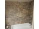 Clean bathroom with large tiled shower and built-in shelves at 4163 Pirates Lndg, Winter Haven, FL 33884