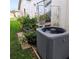 Backyard with AC unit and potted plants at 4163 Pirates Lndg, Winter Haven, FL 33884