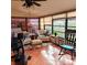 Relaxing sunroom furnished with seating and exercise equipment at 4163 Pirates Lndg, Winter Haven, FL 33884