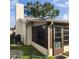 Rear exterior view showing the home's sunroom and grilling area at 4163 Pirates Lndg, Winter Haven, FL 33884