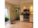 Updated kitchen boasts stainless steel appliances and granite countertops at 4163 Pirates Lndg, Winter Haven, FL 33884