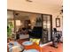 Patio with table and chairs, overlooking living room at 4163 Pirates Lndg, Winter Haven, FL 33884