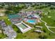 Aerial view showing community pool, tennis, and shuffleboard at 5838 Macaw Pl, Lakeland, FL 33809