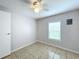 Spacious bedroom with a window and ceiling fan at 6762 Brentwood Ne Dr, Winter Haven, FL 33881