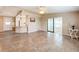 Open living room with kitchen views and tile flooring at 6762 Brentwood Ne Dr, Winter Haven, FL 33881