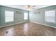 Spacious bedroom with tile floors and ceiling fan at 6762 Brentwood Ne Dr, Winter Haven, FL 33881
