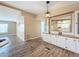 Dining area with wood-look floors and built-in hutch at 6762 Brentwood Ne Dr, Winter Haven, FL 33881