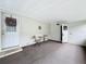 Cozy screened porch with small table and chairs at 6762 Brentwood Ne Dr, Winter Haven, FL 33881