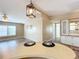 Kitchen with breakfast bar and view into living room at 6762 Brentwood Ne Dr, Winter Haven, FL 33881