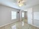 Light and airy bedroom with mirrored closet doors at 6762 Brentwood Ne Dr, Winter Haven, FL 33881