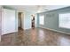 Bright bedroom featuring tile floors and a private bathroom at 6762 Brentwood Ne Dr, Winter Haven, FL 33881