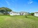 Large backyard with shed and green lawn at 6762 Brentwood Ne Dr, Winter Haven, FL 33881