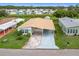 Aerial view of manufactured home with paved driveway and landscaping at 6762 Brentwood Ne Dr, Winter Haven, FL 33881
