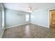 Well-lit bedroom with tile floors and a ceiling fan at 6762 Brentwood Ne Dr, Winter Haven, FL 33881