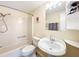 Clean bathroom with a tub, toilet, and vanity at 6762 Brentwood Ne Dr, Winter Haven, FL 33881