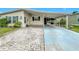 Single-wide home with carport and landscaping at 6762 Brentwood Ne Dr, Winter Haven, FL 33881