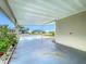 Covered carport providing parking and shade at 6762 Brentwood Ne Dr, Winter Haven, FL 33881