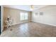 Spacious living room with tile floors and a ceiling fan at 6762 Brentwood Ne Dr, Winter Haven, FL 33881