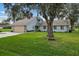 Ranch home with large yard, mature trees, and a swing at 7838 Rolling Grove E Dr, Lakeland, FL 33810