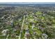 Wide aerial view of a suburban neighborhood with various houses at 7838 Rolling Grove E Dr, Lakeland, FL 33810