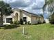 House exterior with solar panels and a well-maintained lawn at 123 Osprey Heights Dr, Winter Haven, FL 33880