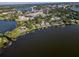 Aerial view showcasing waterfront property and surrounding landscape at 1324 Mirror Nw Ter, Winter Haven, FL 33881