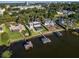 High-angle view of lakefront home with dock and spacious yard at 1324 Mirror Nw Ter, Winter Haven, FL 33881