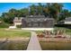 Waterfront home with a large screened pool and patio at 1324 Mirror Nw Ter, Winter Haven, FL 33881