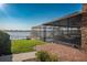Landscaped backyard with lake view and patio at 1324 Mirror Nw Ter, Winter Haven, FL 33881