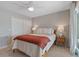 Bedroom with white closet doors and wood flooring at 1324 Mirror Nw Ter, Winter Haven, FL 33881