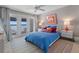Bedroom with lake view, queen bed, and colorful decor at 1324 Mirror Nw Ter, Winter Haven, FL 33881