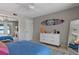 Bedroom with lake view, queen bed, and stylish dresser at 1324 Mirror Nw Ter, Winter Haven, FL 33881