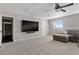 Spacious bonus room with large TV, comfortable seating, and carpet flooring at 1324 Mirror Nw Ter, Winter Haven, FL 33881