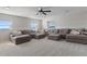 Large bonus room with sectional sofa and carpeted floor at 1324 Mirror Nw Ter, Winter Haven, FL 33881