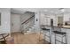 Light and airy entryway with staircase and kitchen view at 1324 Mirror Nw Ter, Winter Haven, FL 33881