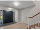 Bright and airy entryway with double doors and hardwood floors at 1324 Mirror Nw Ter, Winter Haven, FL 33881