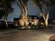 Brick house exterior at night with landscaping and driveway at 1324 Mirror Nw Ter, Winter Haven, FL 33881