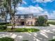 Brick home with circular driveway and lake view at 1324 Mirror Nw Ter, Winter Haven, FL 33881