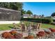 Cozy fire pit area with seating for multiple guests at 1324 Mirror Nw Ter, Winter Haven, FL 33881