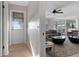Hallway with light flooring and view of living room at 1324 Mirror Nw Ter, Winter Haven, FL 33881