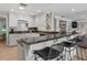 Kitchen with white cabinets, granite counters, and breakfast bar at 1324 Mirror Nw Ter, Winter Haven, FL 33881