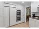 White kitchen with stainless steel appliances and granite countertops at 1324 Mirror Nw Ter, Winter Haven, FL 33881
