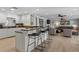Open kitchen with granite countertops and breakfast bar at 1324 Mirror Nw Ter, Winter Haven, FL 33881