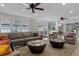 Bright living room with water views and comfortable seating at 1324 Mirror Nw Ter, Winter Haven, FL 33881