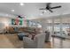 Spacious living area with lake view and cozy seating at 1324 Mirror Nw Ter, Winter Haven, FL 33881